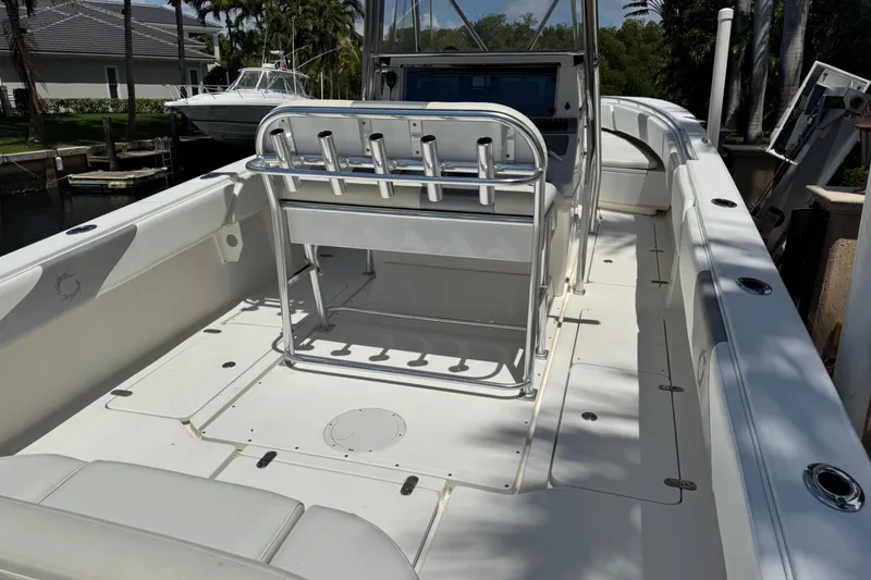 Slide: The Image of 2008 Fountain 34 Center Console boat with spacious deck and rod holders. - 16