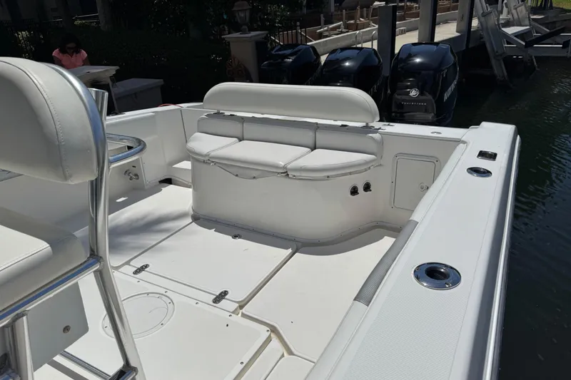 Slide: The Image of 2008 Fountain 34 Center Console boat interior with seating and outboard motors. - 17