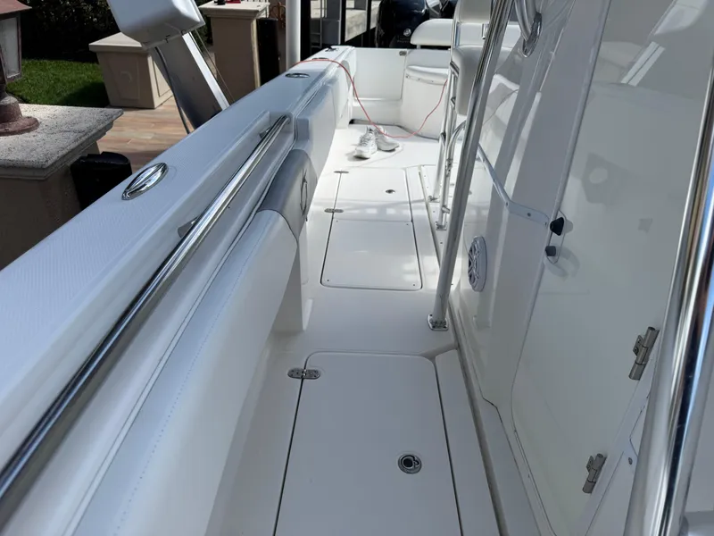 Slide: The Image of 2008 Fountain 34 Center Console boat interior with sleek white design and stainless steel accents. - 22