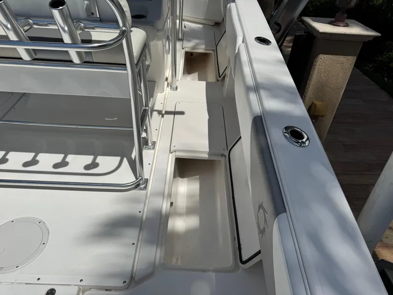Slide: The Image of 2008 Fountain 34 Center Console boat interior with seating and storage compartments. - 25