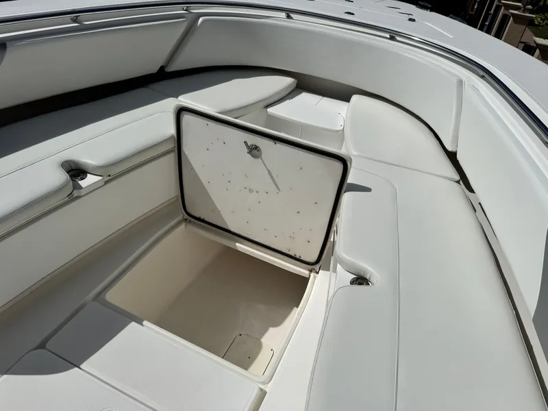Slide: The Image of 2008 Fountain 34 Center Console boat with open storage compartment. - 29