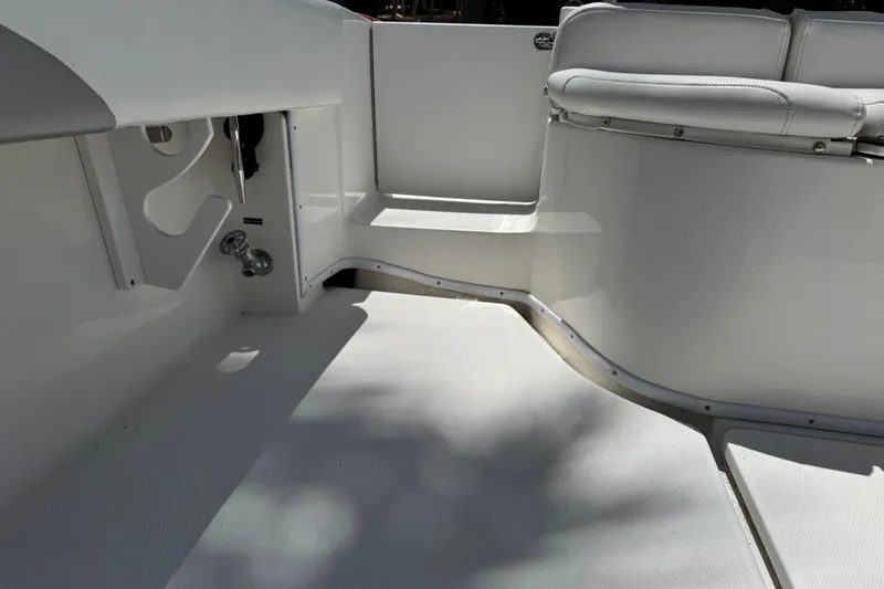 Slide: The Image of 2008 Fountain 34 Center Console boat interior with white seating and clean deck. - 30
