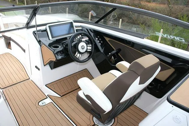 Slide: The Image of 2022 Yamaha Boats 252SD cockpit with modern dashboard and comfortable seating. - 6