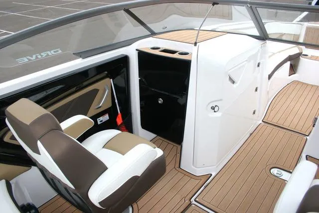 Slide: The Image of 2022 Yamaha Boats 252SD interior with sleek seating and modern dashboard design. - 7