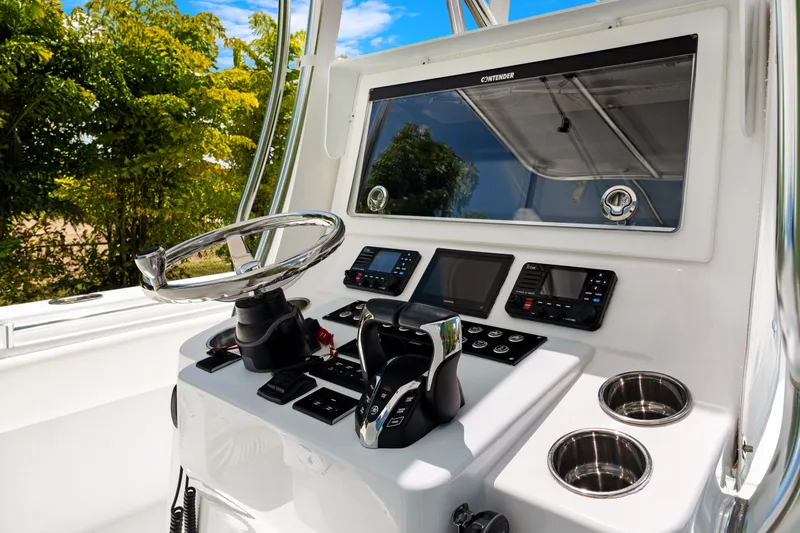 Slide: The Image of 2024 Contender 35 ST boat helm with modern controls and navigation systems. - 32