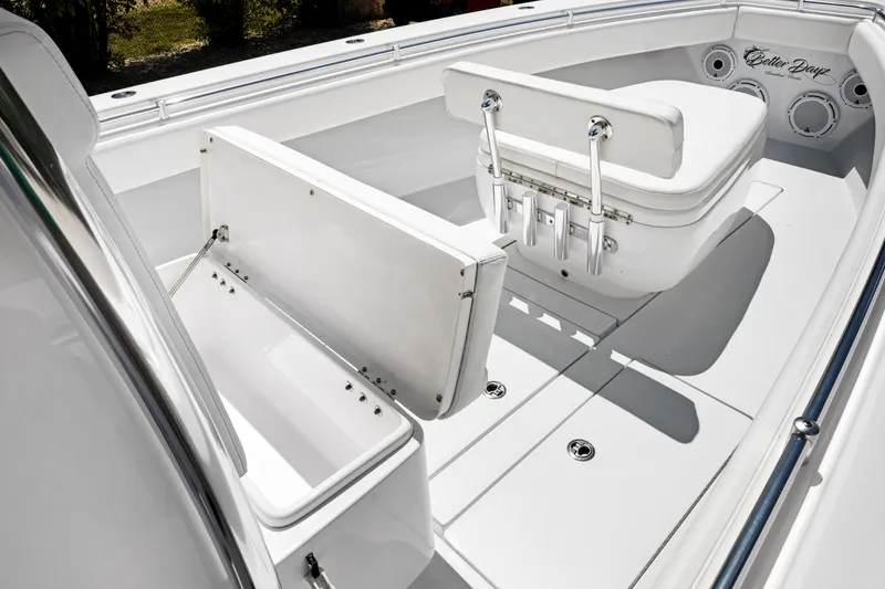 Slide: The Image of 2024 Contender 35 ST boat interior with seating and storage compartments. - 36