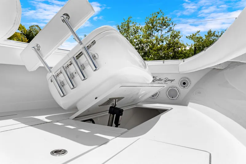 Slide: The Image of 2024 Contender 35 ST boat interior with rod holders and storage compartment. - 38