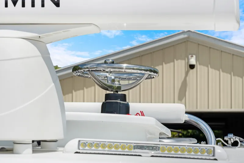 Slide: The Image of 2024 Contender 35 ST boat helm with modern steering wheel and LED lights. - 40