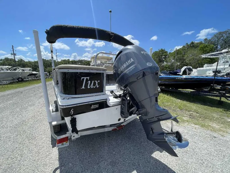 Slide: The Image of 2023 Hurricane Fundeck 198 Fish Package with Yamaha outboard motor, parked outdoors. - 3