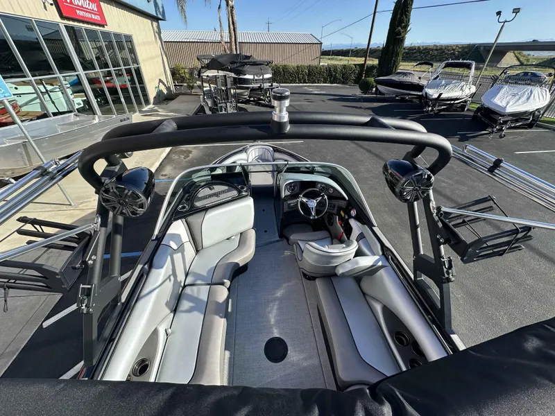 Slide: The Image of 2025 Sanger V215 SX boat interior with sleek seating and advanced audio system. - 10