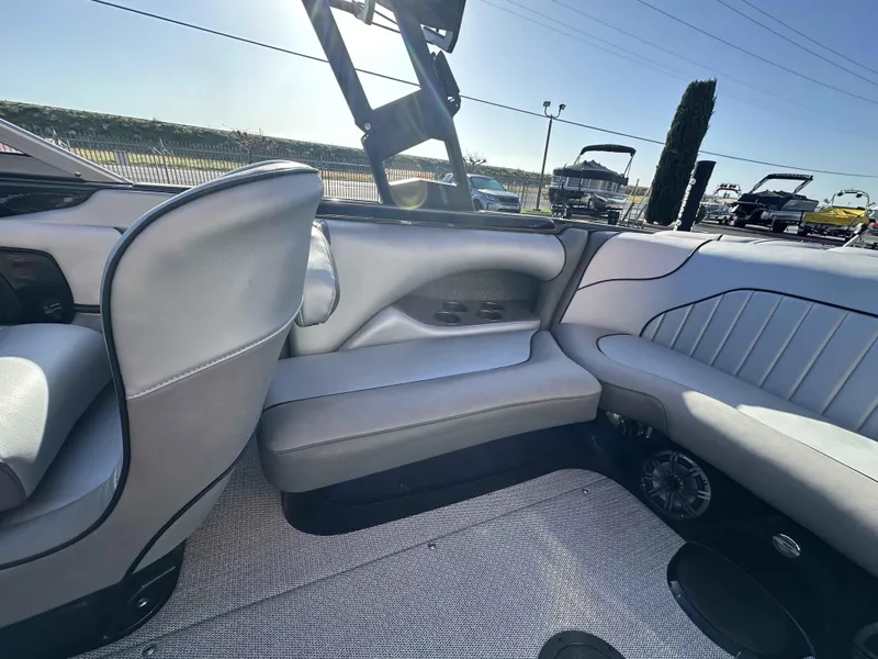 Slide: The Image of 2025 Sanger V215 SX boat interior with gray seating and modern design. - 8
