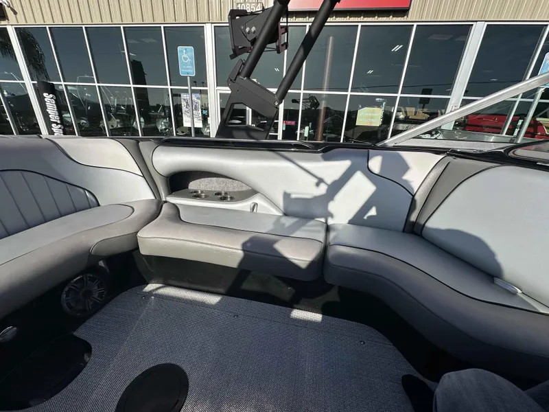 Slide: The Image of Interior of 2025 Sanger V215 SX boat with gray seating and cup holders. - 9