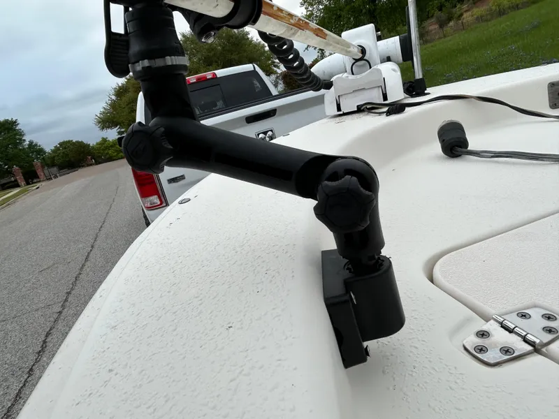 Slide: The Image of 2017 Carolina Skiff JVX Pre-Rig Series 18 boat with mounted equipment, parked on a street. - 11