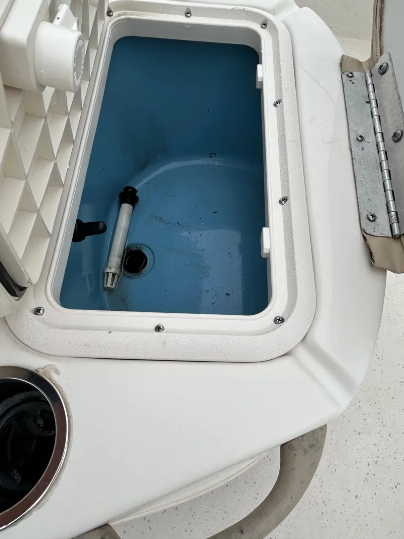 Slide: The Image of Open storage compartment on 2017 Carolina Skiff JVX Pre-Rig Series 18 boat. - 14