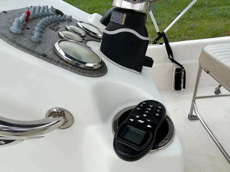 Slide: The Image of Control panel of 2017 Carolina Skiff JVX Pre-Rig Series 18 boat with gauges and remote. - 16