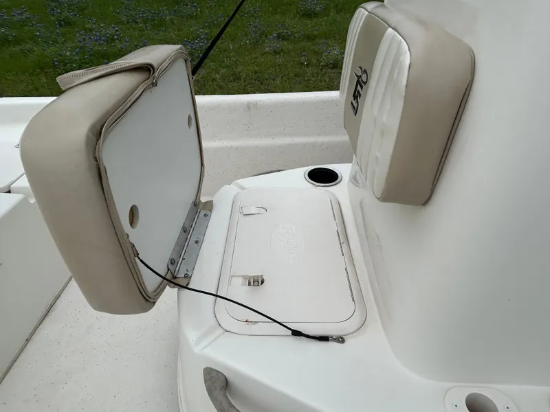 Slide: The Image of 2017 Carolina Skiff JVX Pre-Rig Series 18 boat seat and storage compartment. - 17