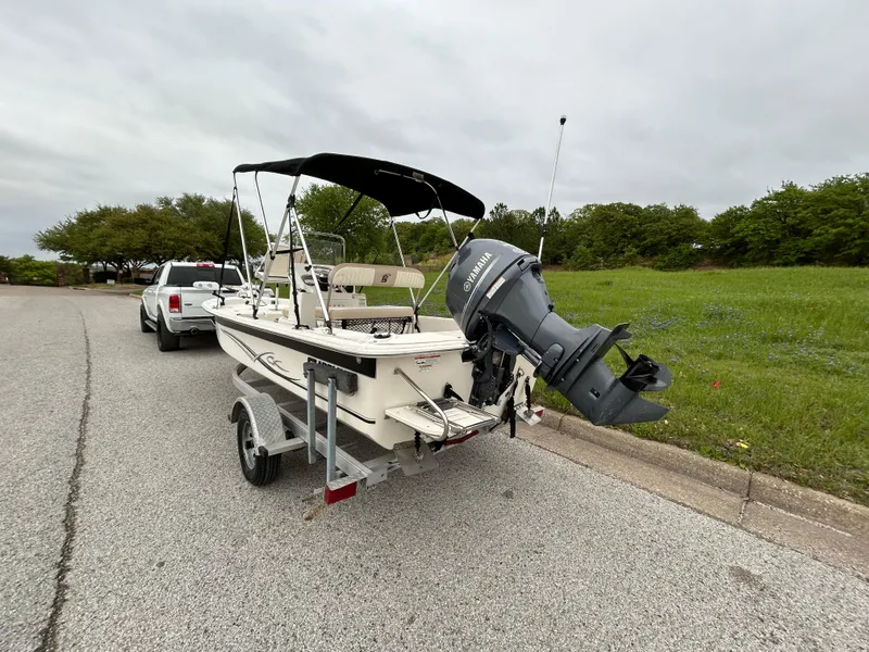 Slide: The Image of 2017 Carolina Skiff JVX Pre-Rig Series 18 boat on trailer, parked on roadside. - 2