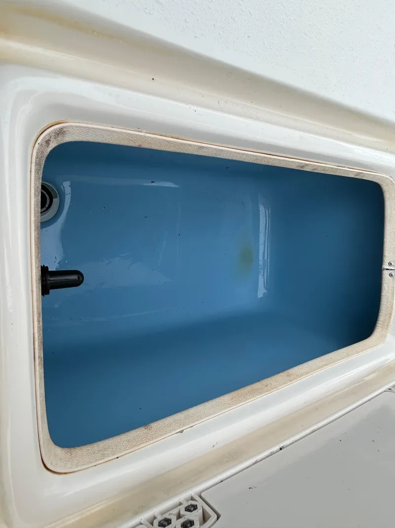 Slide: The Image of 2017 Carolina Skiff JVX Pre-Rig Series 18 livewell interior, blue and white finish. - 20