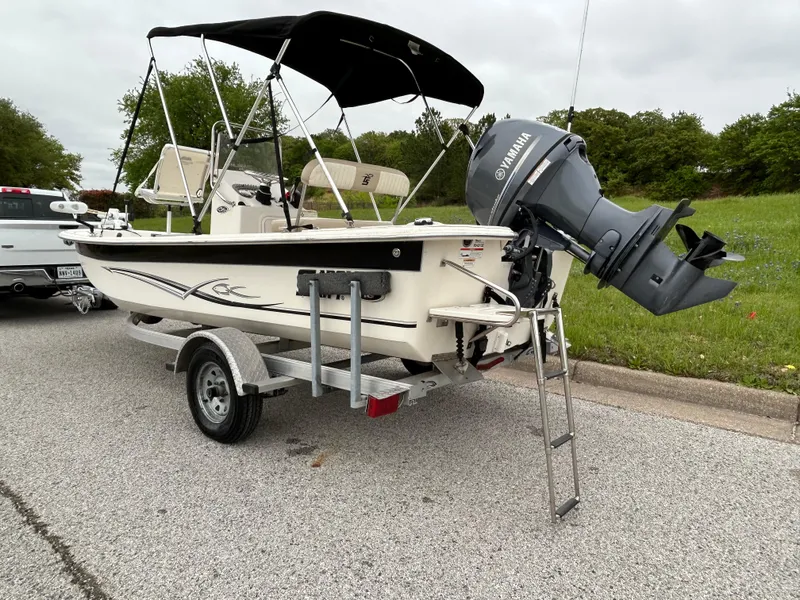 Slide: The Image of 2017 Carolina Skiff JVX Pre-Rig Series 18 boat on trailer with Yamaha outboard motor. - 22