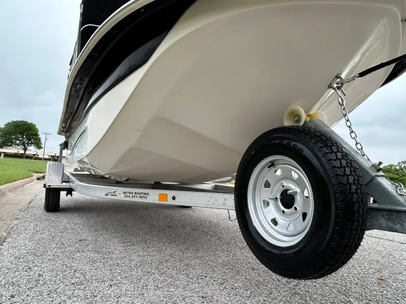 Slide: The Image of 2017 Carolina Skiff JVX Pre-Rig Series 18 on trailer, showcasing hull and wheel detail. - 24