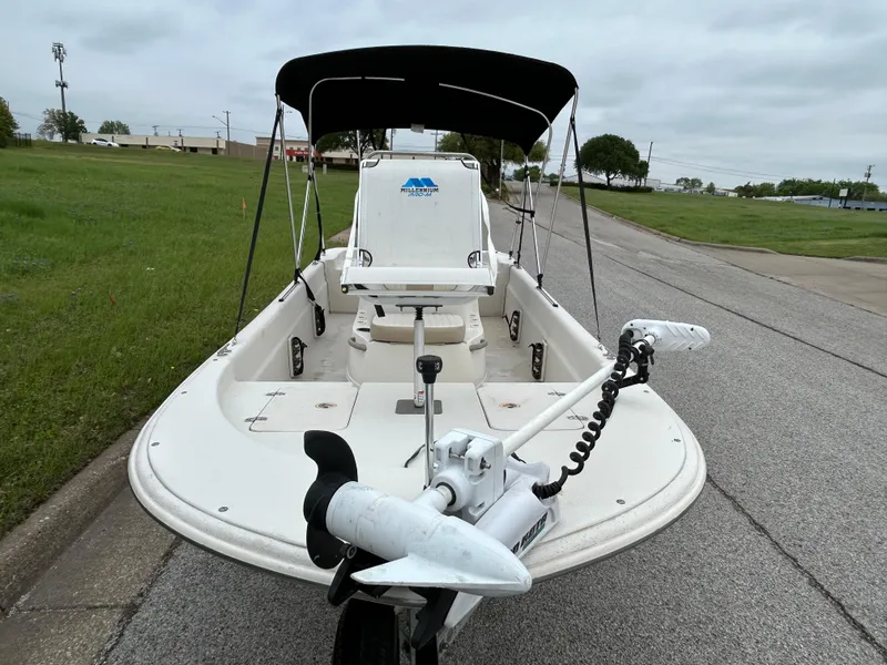 Slide: The Image of 2017 Carolina Skiff JVX Pre-Rig Series 18 boat with canopy on a road. - 27