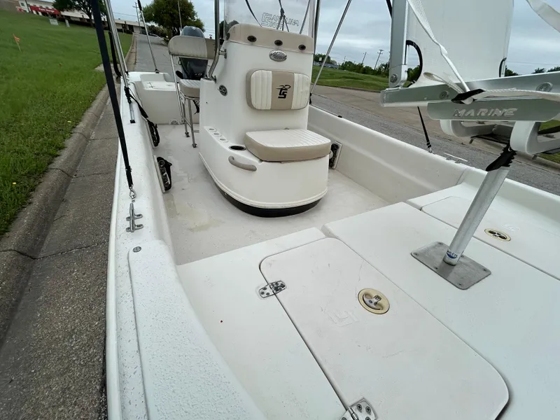 Slide: The Image of 2017 Carolina Skiff JVX Pre-Rig Series 18 boat interior with seating and storage compartments. - 28