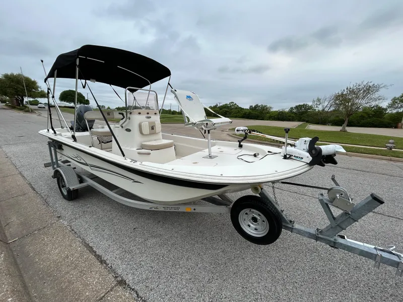 Slide: The Image of 2017 Carolina Skiff JVX Pre-Rig Series 18 boat on trailer, parked on street. - 42