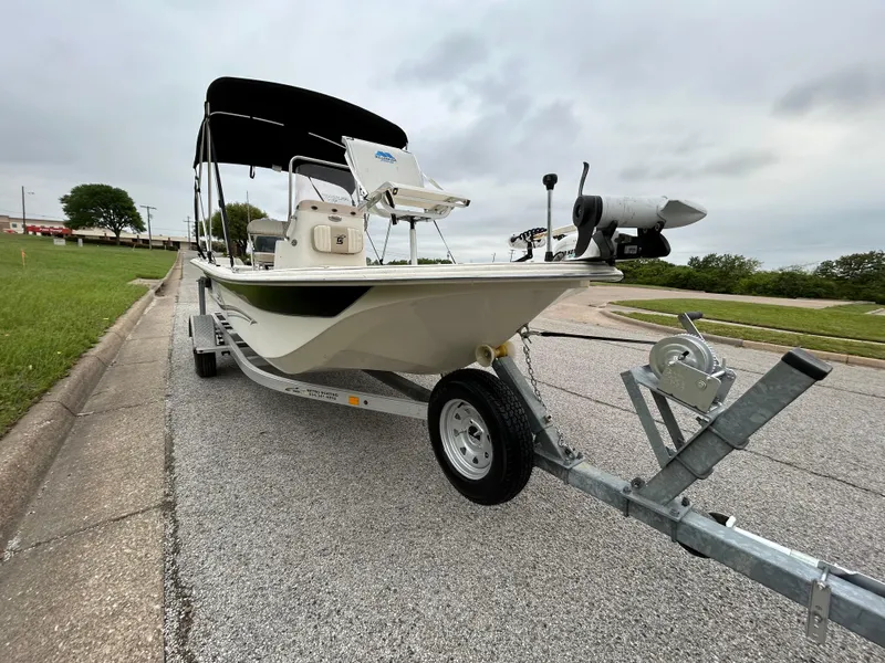 Slide: The Image of 2017 Carolina Skiff JVX Pre-Rig Series 18 boat on trailer, parked on roadside. - 43