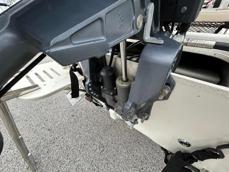 Slide: The Image of 2017 Carolina Skiff JVX Pre-Rig Series 18 boat motor close-up on pavement. - 47