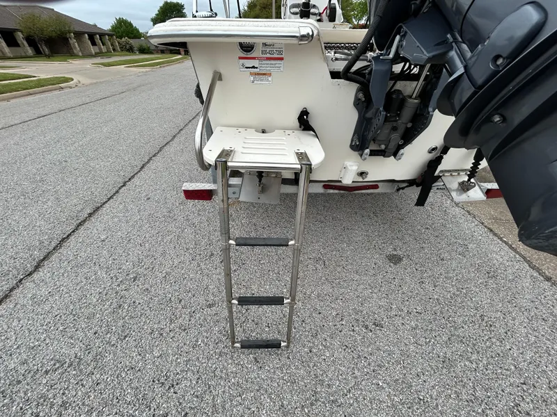 Slide: The Image of 2017 Carolina Skiff JVX Pre-Rig Series 18 with ladder on a street. - 6