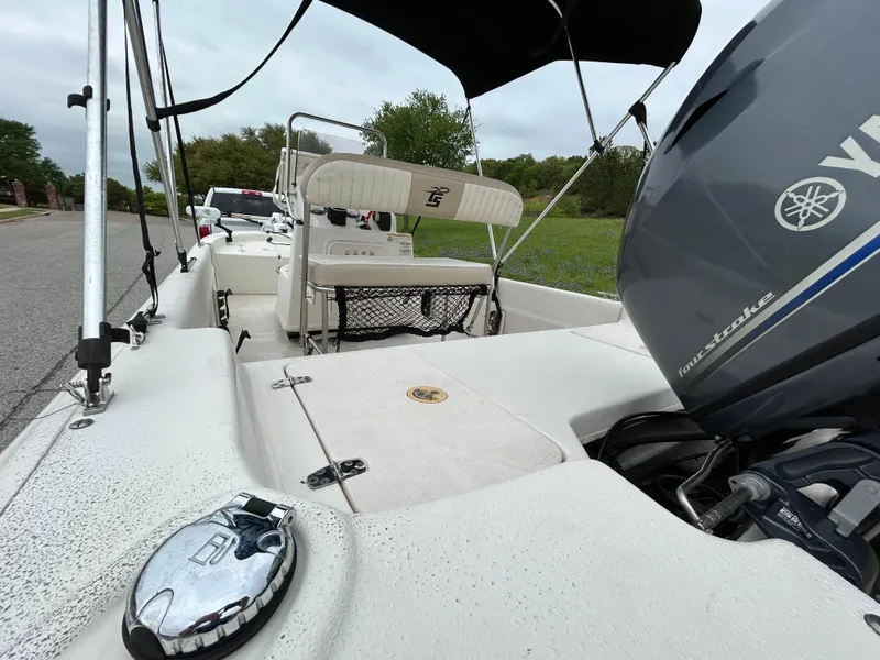 Slide: The Image of 2017 Carolina Skiff JVX Pre-Rig Series 18 boat with Yamaha engine, parked on roadside. - 8