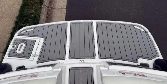 Slide: The Image of 2013 Regal 2700 Bowrider boat deck with gray non-slip surface. - 12