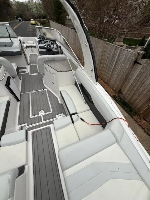 Slide: The Image of 2013 Regal 2700 Bowrider boat with spacious seating and modern design. - 16