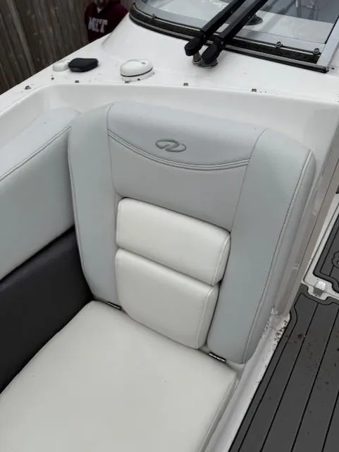 Slide: The Image of 2013 Regal 2700 Bowrider boat seat with gray and white upholstery. - 26