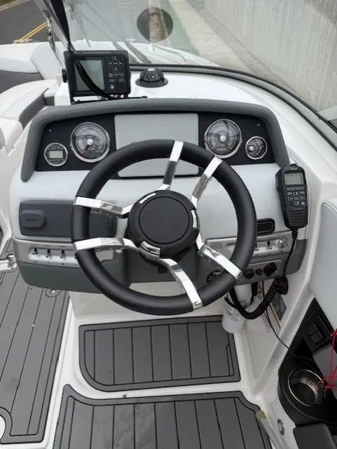 Slide: The Image of Steering wheel and dashboard of 2013 Regal 2700 Bowrider boat. - 27