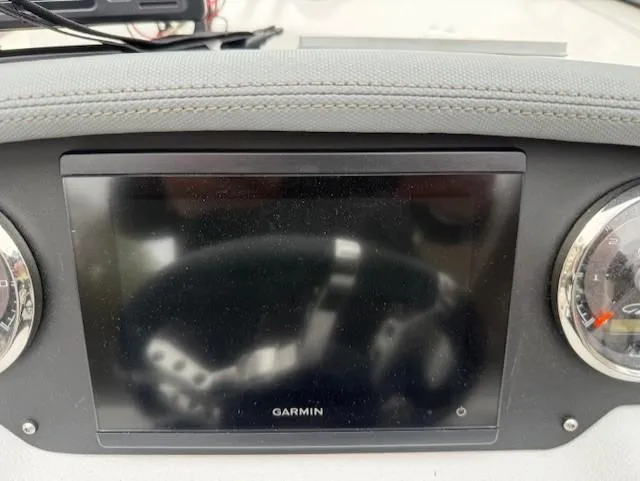 Slide: The Image of Garmin display on 2013 Regal 2700 Bowrider dashboard with gauges. - 29