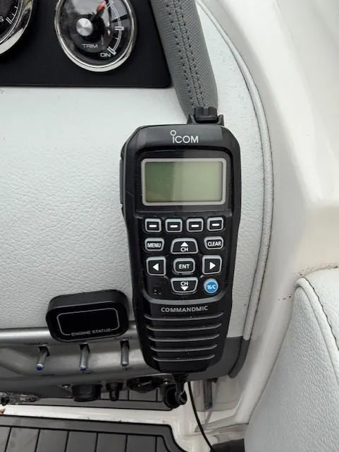 Slide: The Image of ICOM CommandMic on 2013 Regal 2700 Bowrider dashboard, featuring control buttons and display. - 31