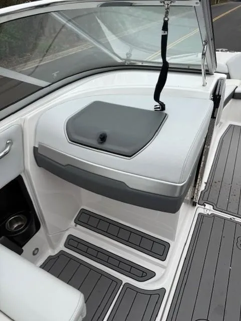 Slide: The Image of 2013 Regal 2700 Bowrider interior with gray seating and non-slip flooring. - 33