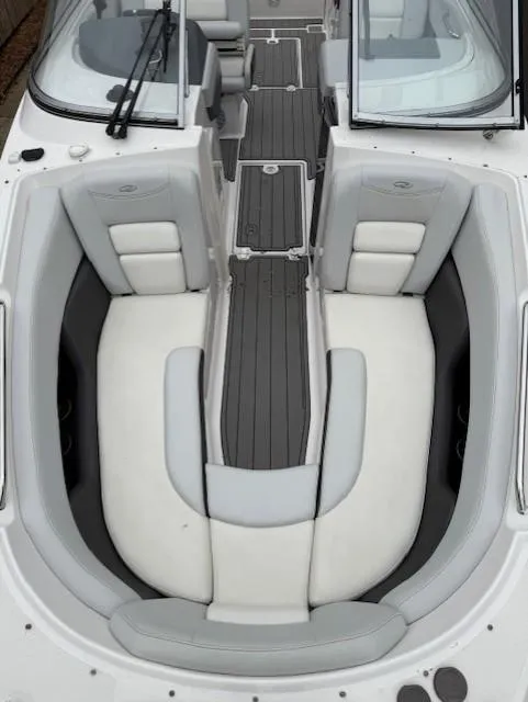 Slide: The Image of 2013 Regal 2700 Bowrider boat interior with white and gray seating. - 39