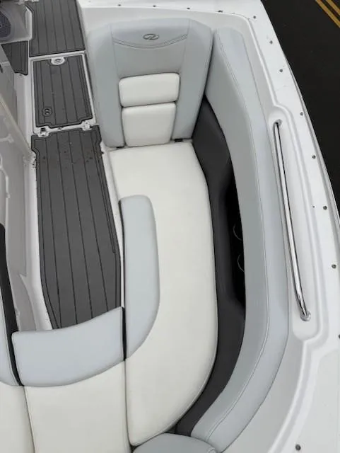 Slide: The Image of 2013 Regal 2700 Bowrider boat interior with gray and white seating. - 41