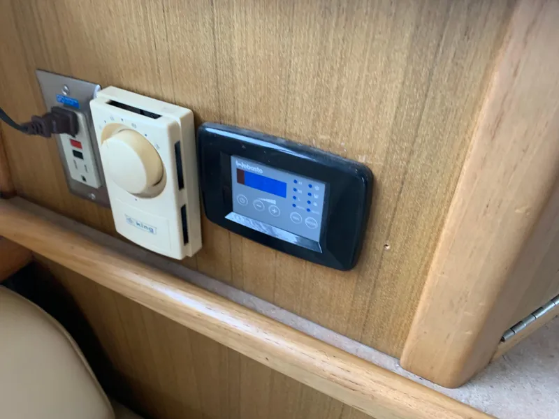 Slide: The Image of Control panel and thermostat on 2000 Bayliner 3988 yacht interior. - 11