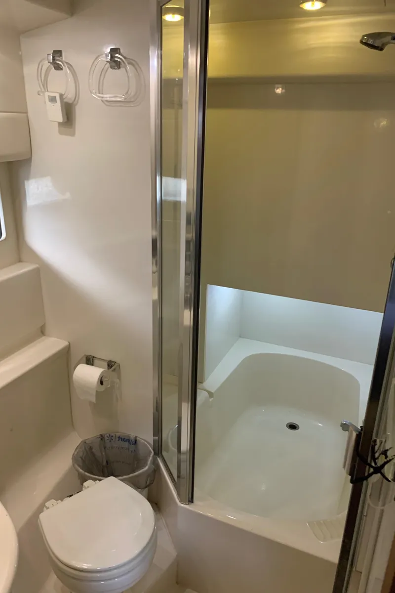 Slide: The Image of Bathroom interior of 2000 Bayliner 3988 yacht with shower and toilet. - 18