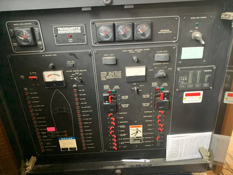 Slide: The Image of Electrical control panel of a 2000 Bayliner 3988 boat with gauges and switches. - 22