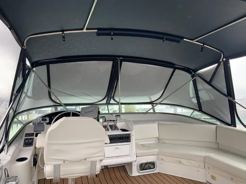 Slide: The Image of Interior view of 2000 Bayliner 3988 yacht with helm and seating area. - 23