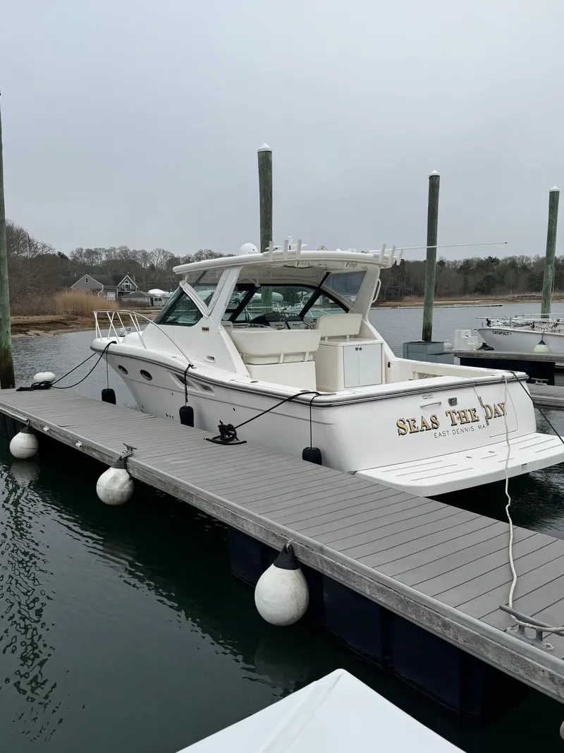 Slide: The Image of 2009 Tiara Yachts 32 Open docked, featuring sleek design and spacious deck. - 1