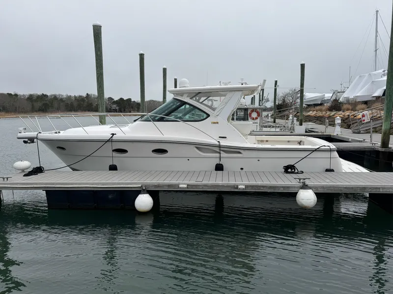 Slide: The Image of 2009 Tiara Yachts 32 Open docked at marina, side view. - 2