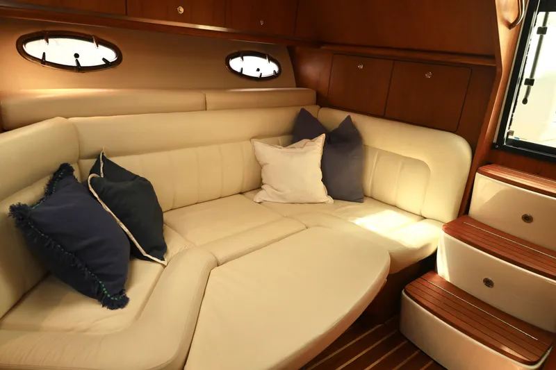 Slide: The Image of Luxurious interior of 2009 Tiara Yachts 32 Open with plush seating and cushions. - 21