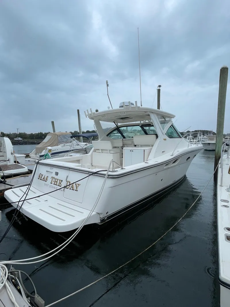 Slide: The Image of 2009 Tiara Yachts 32 Open docked, featuring sleek design and spacious deck. - 3