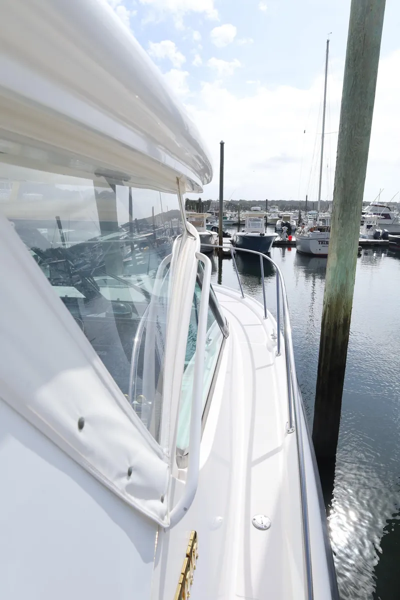 Slide: The Image of 2009 Tiara Yachts 32 Open docked at a marina, showcasing sleek design and craftsmanship. - 7