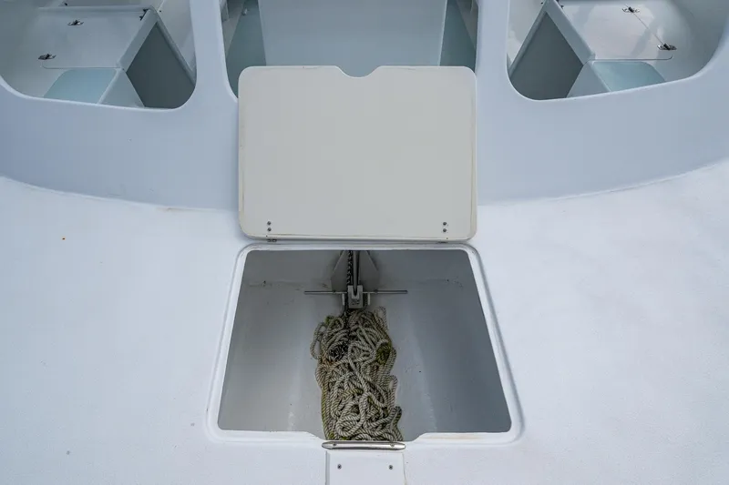 Slide: The Image of Anchor storage compartment on 2019 Aventura 31 Cat boat with rope inside. - 12